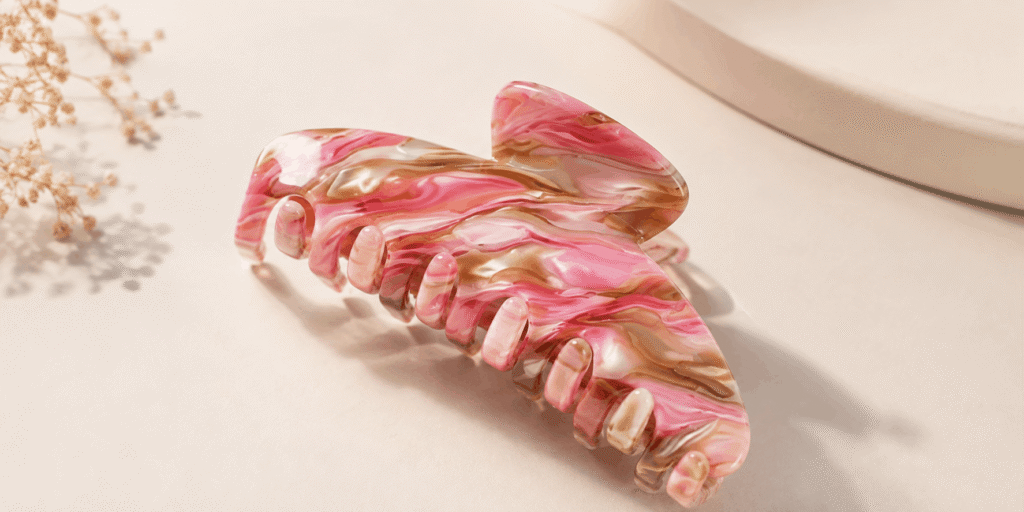 Pink and brown marbled hair claw clip with glossy swirled design