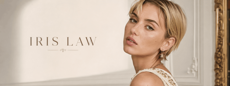 Iris Law wearing an elegant outfit with short blonde hair and natural makeup.